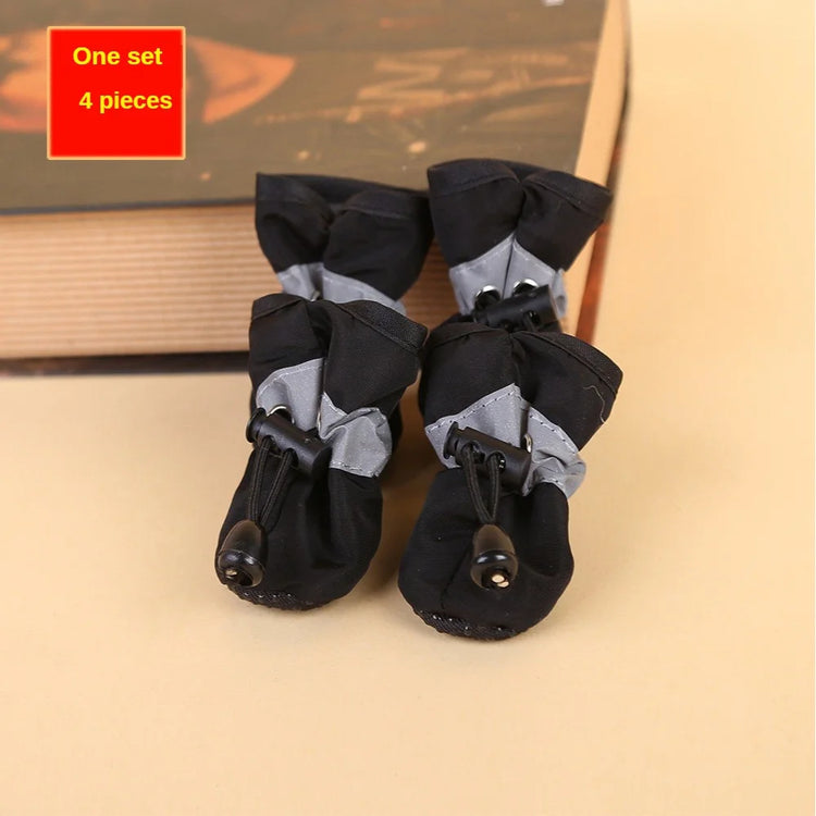 Set of four black dog rain boots