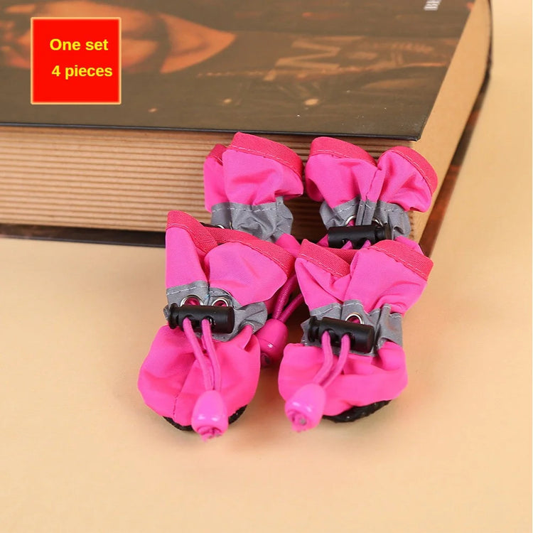 Set of four pink dog rain boots