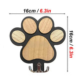 Wooden leash hanger in a paw shape with wall-mounted hook for easy access to leashes and collars.